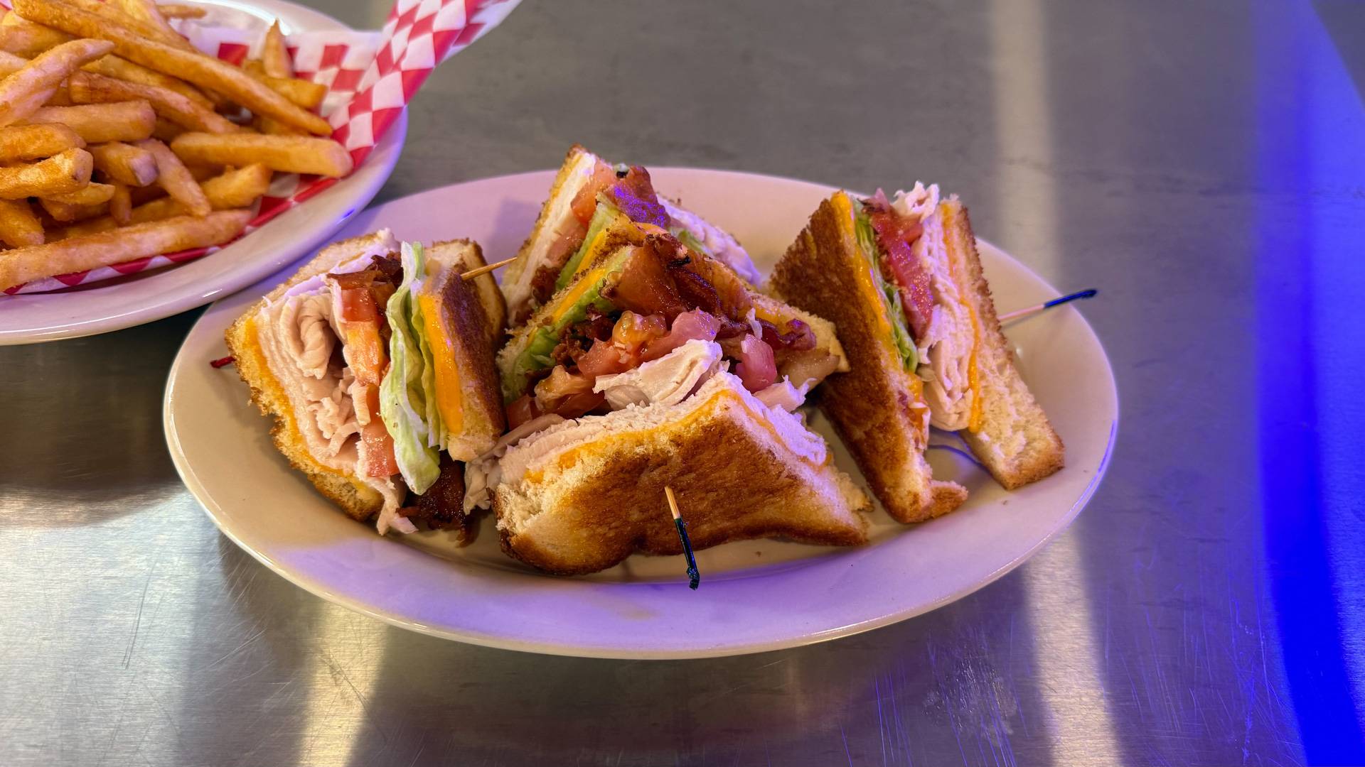 Classic Turkey Club Sandwich at Brooks Burgers Naples with freshly sliced turkey, bacon, lettuce, and tomato.